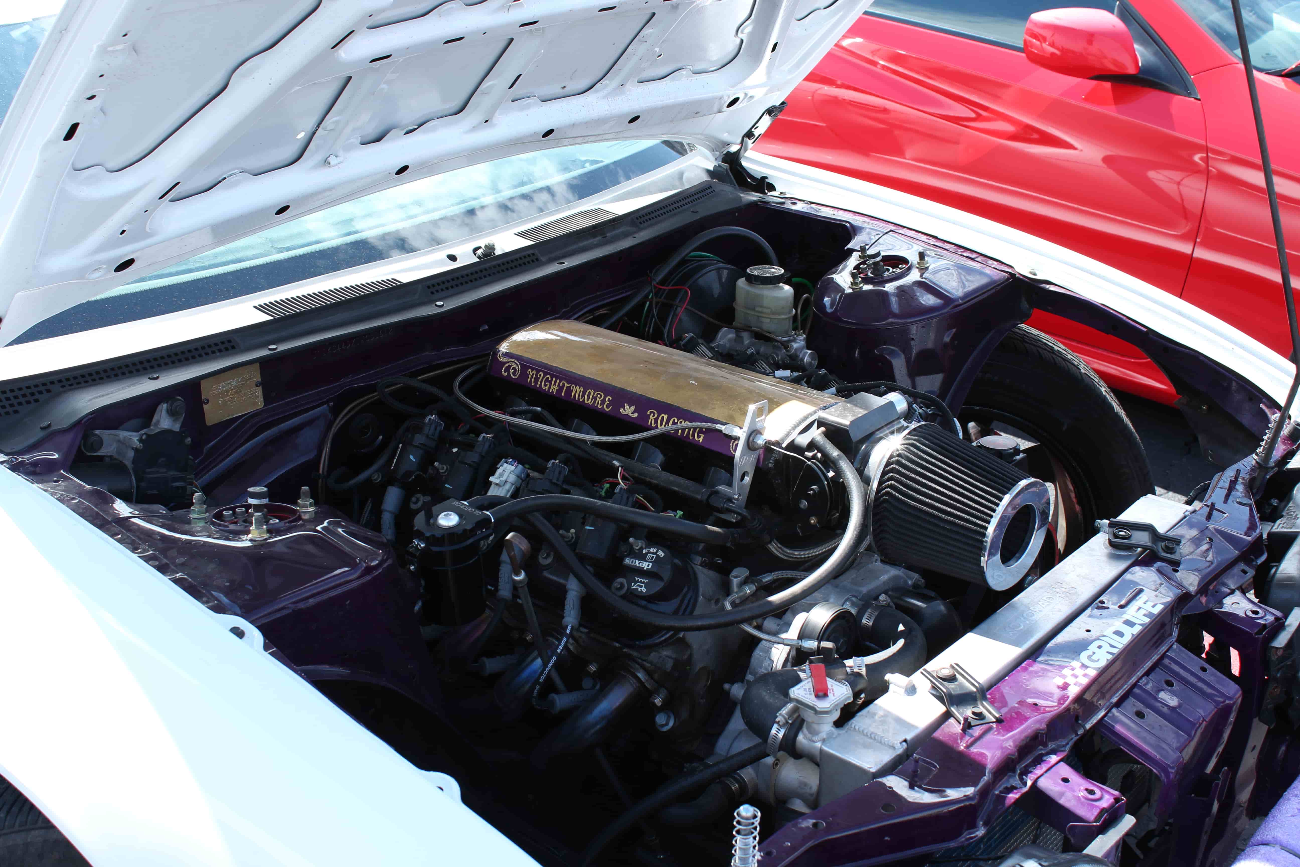 Nightmare Racing team working on a performance build